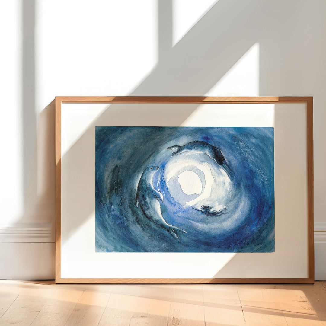 Framed artwork with swirling blue and white waters with seal and selkies swimming towards the full moon.