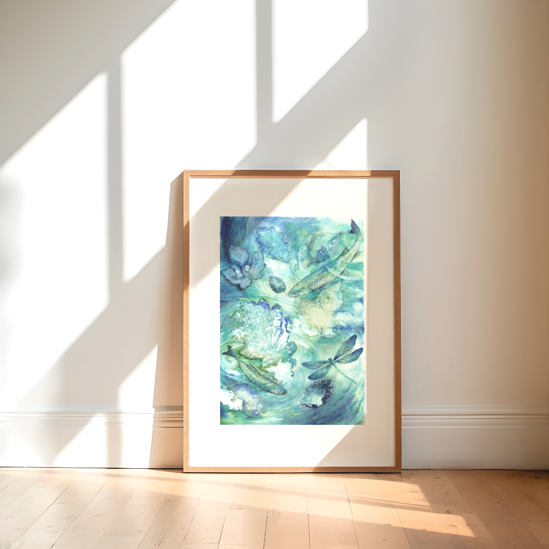fine art print of a watercolour artwork of fish and swirling water in a frame in a sunlit room