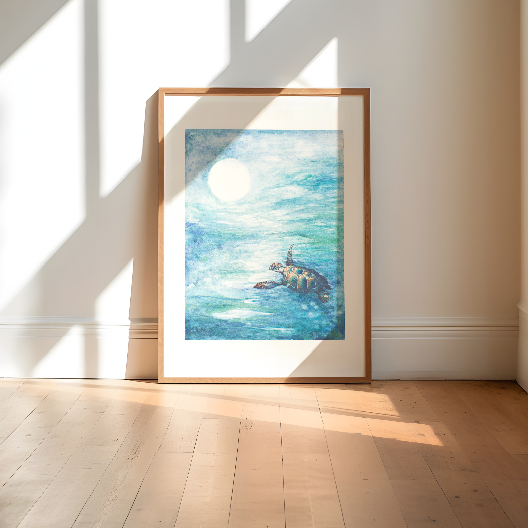 Framed artwork of a turtle in an ocean scene on a wall with sunlight casting shadows.